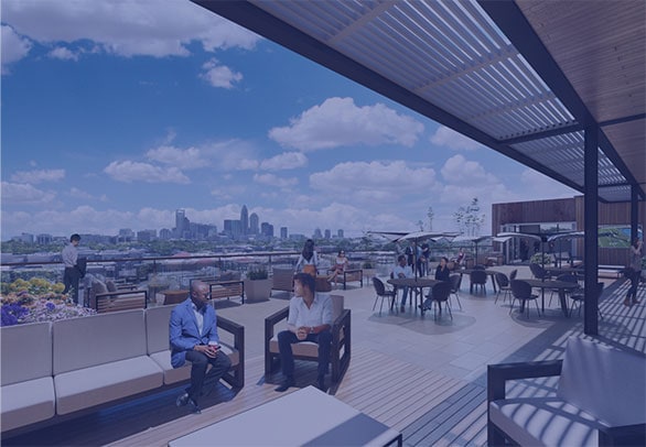 Rooftop lounge area with downtown Charlotte views