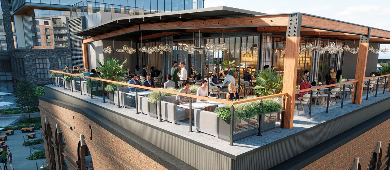 People enjoy rooftop restaurant and lounge area with tables and chairs